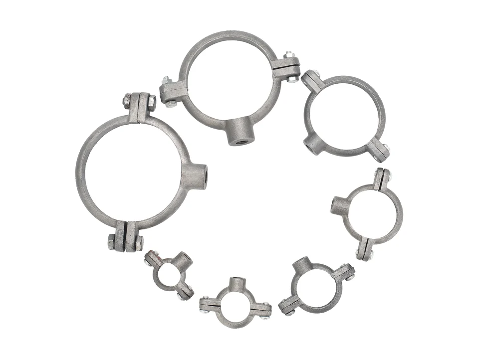 Assortment of photographed split-ring pipe clamps.